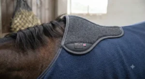 Detail shot of fleece cooler rug for horses with protective wither pad