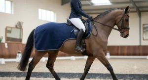 A fleece exercise sheet for horses featuring convenient cut-away sides for a close contact leg aid during schooling.