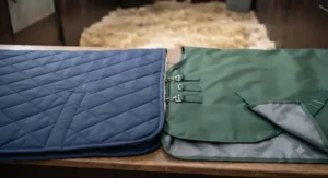 A lightweight stable rug displayed alongside a turnout rug to show the difference in indoor vs outdoor materials