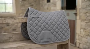 A grey best-value all-purpose numnah designed for comfort during schooling sessions.