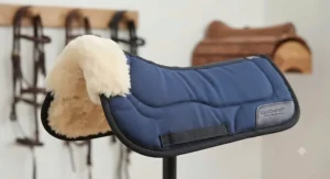 Close-up of a durable and affordable half pad featuring soft fleece trim for added comfort at the wither.