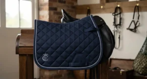 Durable cotton dressage saddle cloth with secure girth straps, available for under £40.