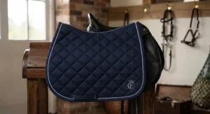Smart navy blue dressage saddle pad designed for comfort, priced under £40 for UK riders.