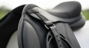 Close-up of the reinforced stirrup attachment on an affordable treeless saddle.