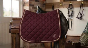 Stylish dressage saddle pad featuring elegant piping, excellent value at under £40.