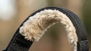 Soft faux-sheepskin lining on an inexpensive anatomic girth designed to prevent chafing